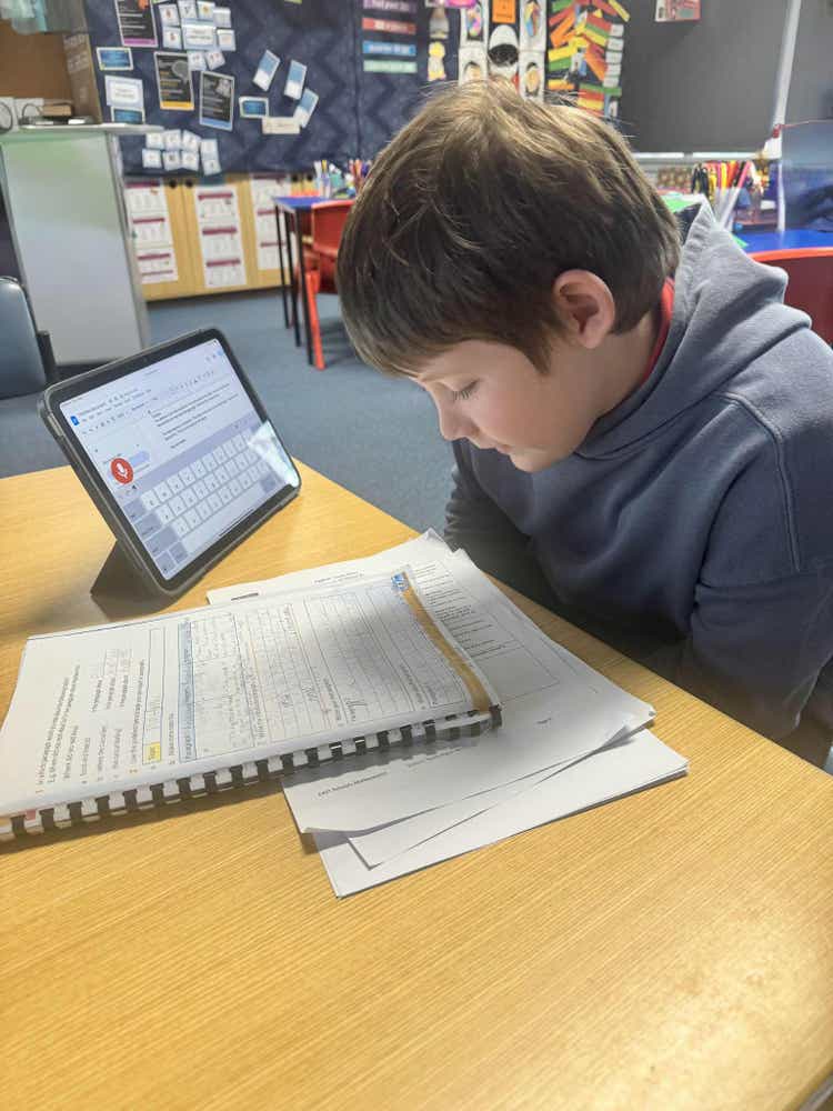 Student utilising digital learning tools