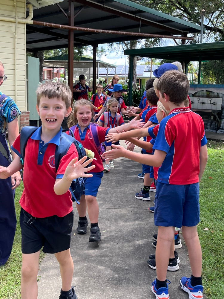 Students giving high fives